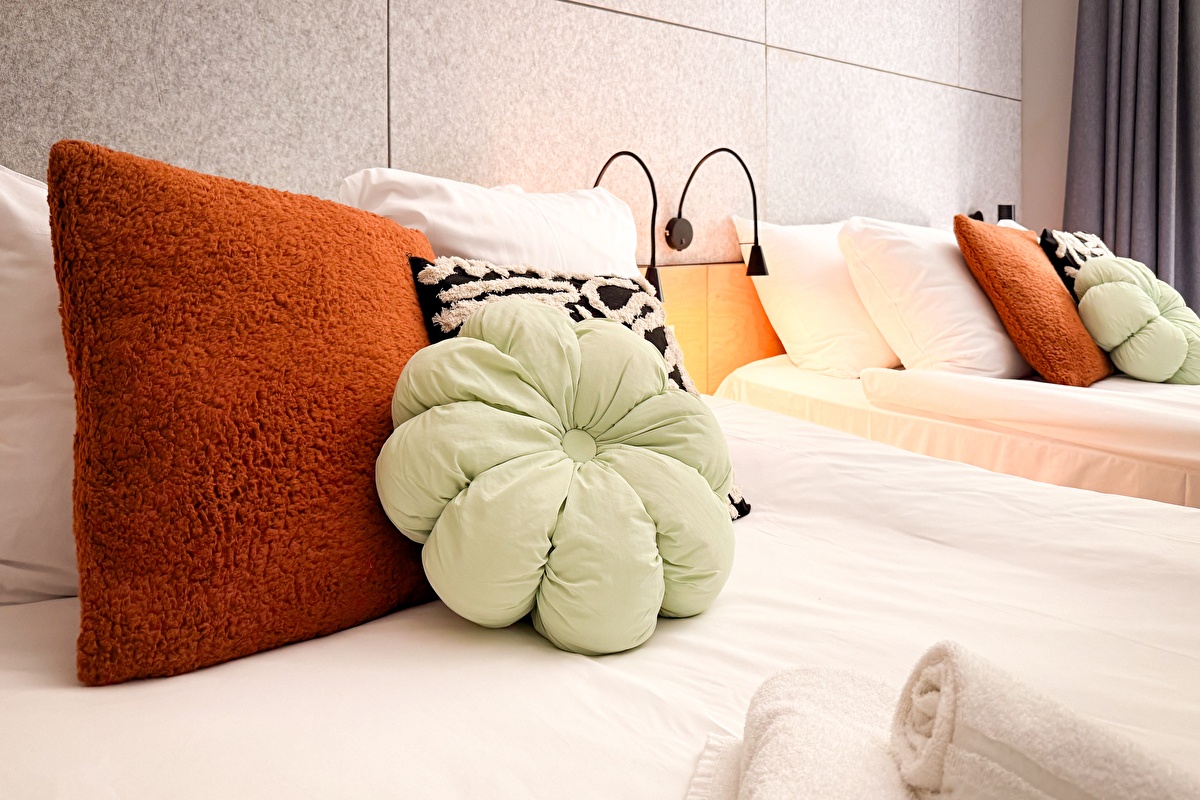 Family quad room beds with pillows